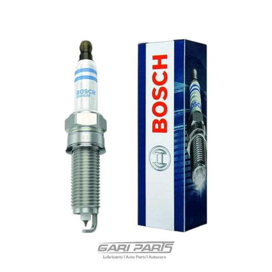 A Bosch spark plug shown next to its blue and white retail box on a plain white background, with a small Gari Parts watermark at the bottom.